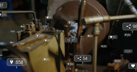 Operator using lathe, tool cutting, chips flying, social icons growing over Stock Footage 331063015