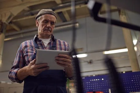 Operator using tablet pc in the factory 스톡 사진