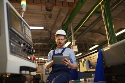 Operator using tablet pc in the plant Stock Photos
