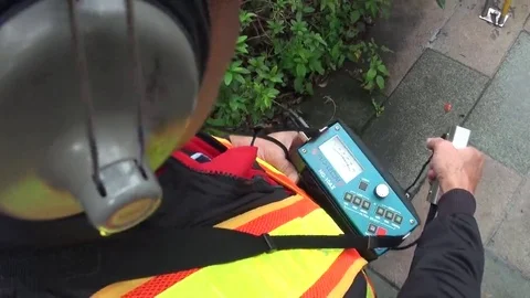 An operator is using a water leak detector, image from his head. Stock Footage 69269077
