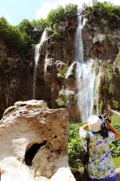 The operator at the waterfall Stock Photos