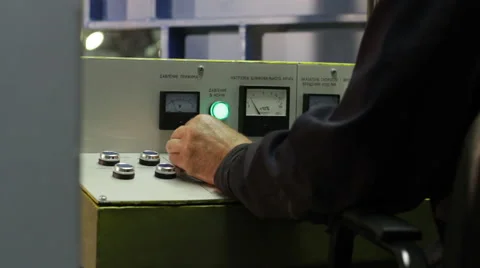 The operator working behind the control console of the grinding machine Stock Footage 61326703