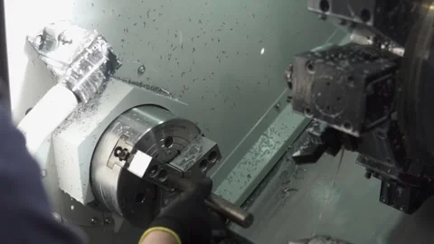 Operator Working With CNC Lathe Machine in Industrial Workshop Stock Footage 340001128