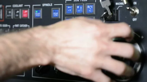 Operator working with control panel of CNC machining center rotating handle jog Stock Footage 49012555