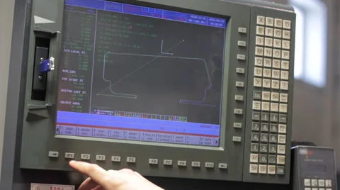 Operator working with control panel of CNC machining centerchanging numbers 스톡 동영상 60235161