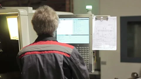 Operator working with control panel of CNC machining centerchanging numbers 스톡 동영상 60236011