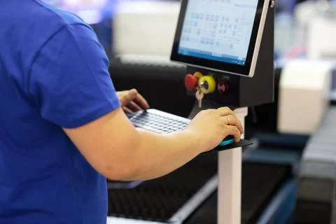 Operator working with industrial control console Stock Photos