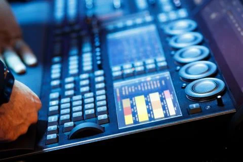 Operator working with lighting control console Stock Photos