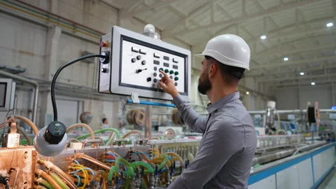 Operator working at programmable CNC machine in factory industries 스톡 동영상 314235054