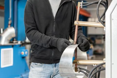 Operator is working with spot welding process. Two pieces of steel are melted Stock Photos