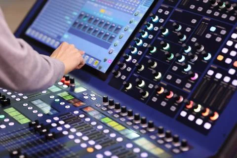 Operator working with stage lighting console Stock Photos