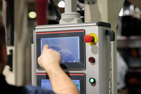 Operator working with touchscreen control panel Stock Photos