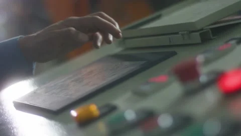 Operator works at the control panel of the machine Stock Footage 162907416
