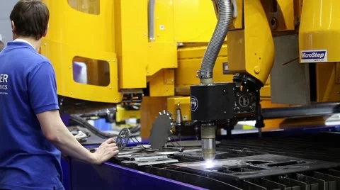 Operator works on fully automated laser cutting machine Stock Footage 52222382