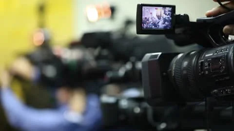 Operator zoom in camera and rotate it, v... | Stock Video | Pond5