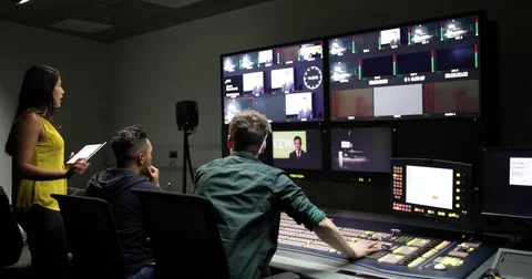 Operators in a control room at a television studio Stock Footage 82120952