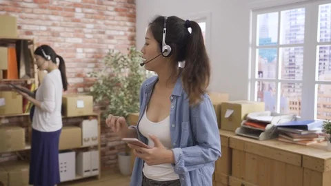 Operators in headsets talking with customer Stock Footage 122732652