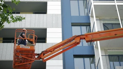Operators in a Hydraulic Lifting Platform. Building Workers Stock Footage 89350558