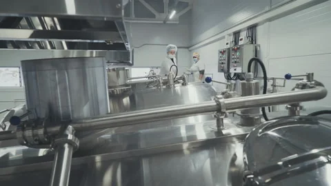 Operators Observing Curd Production Process.Control Panel.Diary Food manufacture Stock Footage 158558385