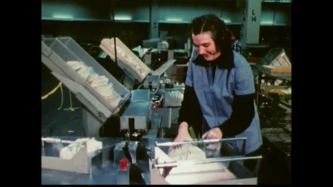 Operators read zip codes and use letter sorting machines and mail travels in Stock Footage 115372232