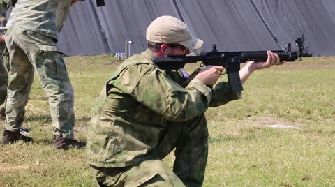 Operators Shoot from Kneeling and Standing Position Stock Footage 44188816