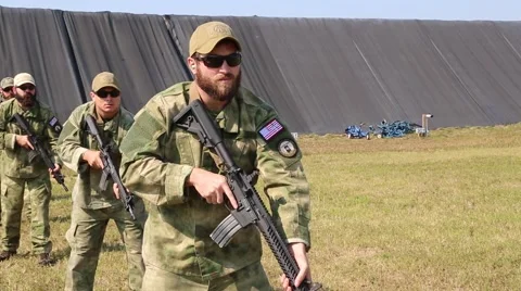 Operators Turn and Fire on Target Stock Footage 44188771