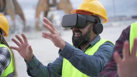 Operators with virtual reality goggles viewing the work operation. Stock Footage 171981281