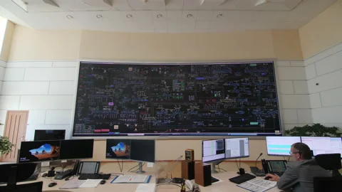 Operators work on computers in control room of substation Stock Footage 154904919