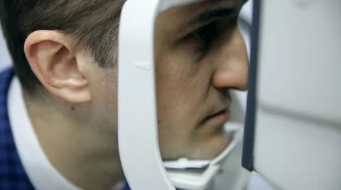 An ophthalmologist is checking a man's vision Stock Footage 62804256