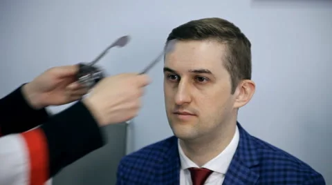 An ophthalmologist is checking a man's vision Stock Footage 62804630