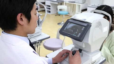 Ophthalmologist Performing Eye Test with Autorefractor on Female Patient Stock-Footage 344236867