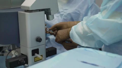 Ophthalmologist preparing anesthesia syringe for eye surgery Stock Footage 328052373