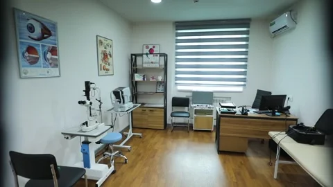 Ophthalmologist's office, microscope, table, computer, air conditioner Stock Footage 248904935