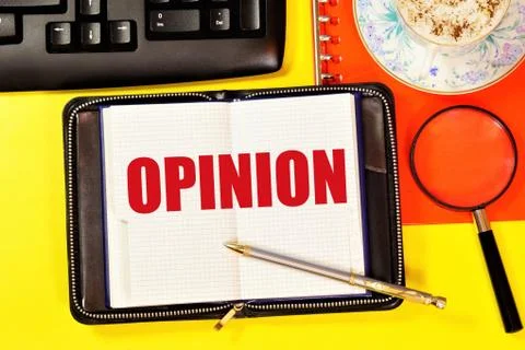 Opinion. The text label in the working notebook. Stock Photos