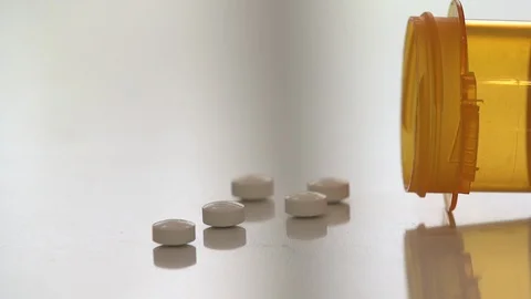 Opioid Pills Spill on Counter Stock Footage