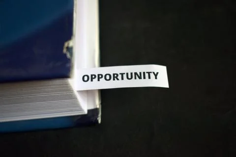 Opportunity Concept Bookmark Inserted in Book Representing Growth, Success .. Fotos de archivo