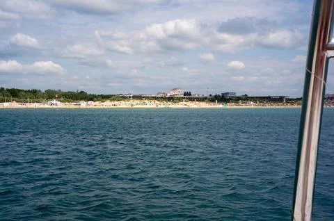 The opposite shore is visible beyond the sea Stock Photos