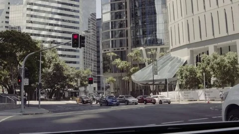 Opposite traffic movement while standing at red lights rear seat view Stock Footage 73376596