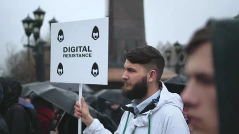 Opposition demonstration strike for internet freedom. Guy with resistance banner Stock Footage 164885601