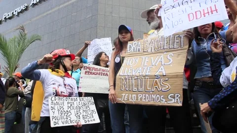Opposition supporters  during a protest against Venezuelan government Stock Footage 158563105