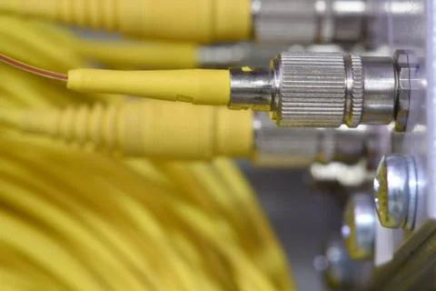 Optic fiber cables on distribution panel Stock Photos