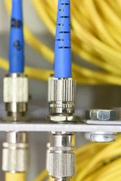 Optic fiber cables on distribution panel Stock Photos