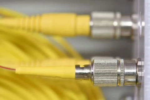 Optic fiber cables on distribution panel Stock Photos
