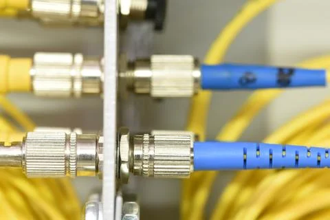 Optic fiber cables on distribution panel Stock Photos