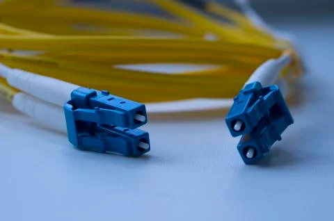 Optical cable, optical cable connector. Connecting optical patch cords. Stock Photos
