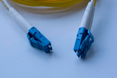 Optical cable, optical cable connector. Connecting optical patch cords. Stock Photos