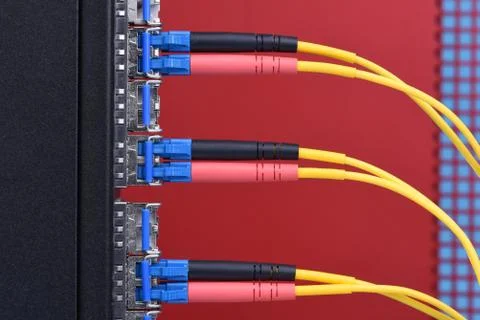 Optical cables connectec to switch Stock Photos