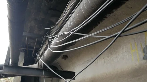 Optical communication cable laid under the bridge Stock Footage 126947955