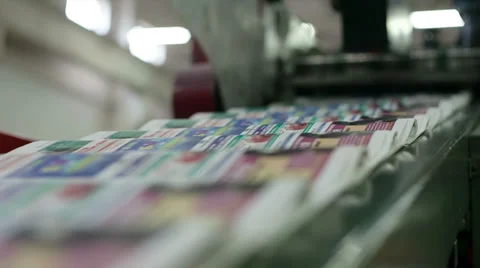 Optical controller counts the number of newspapers on line Video stock 39145303