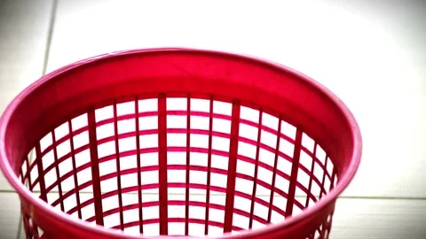 Optical DVD or CD Discs falling in to red trash bin Video stock 76688668